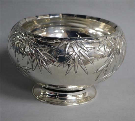 A Japanese foliate-embossed silver bowl on foot (a.f.)
